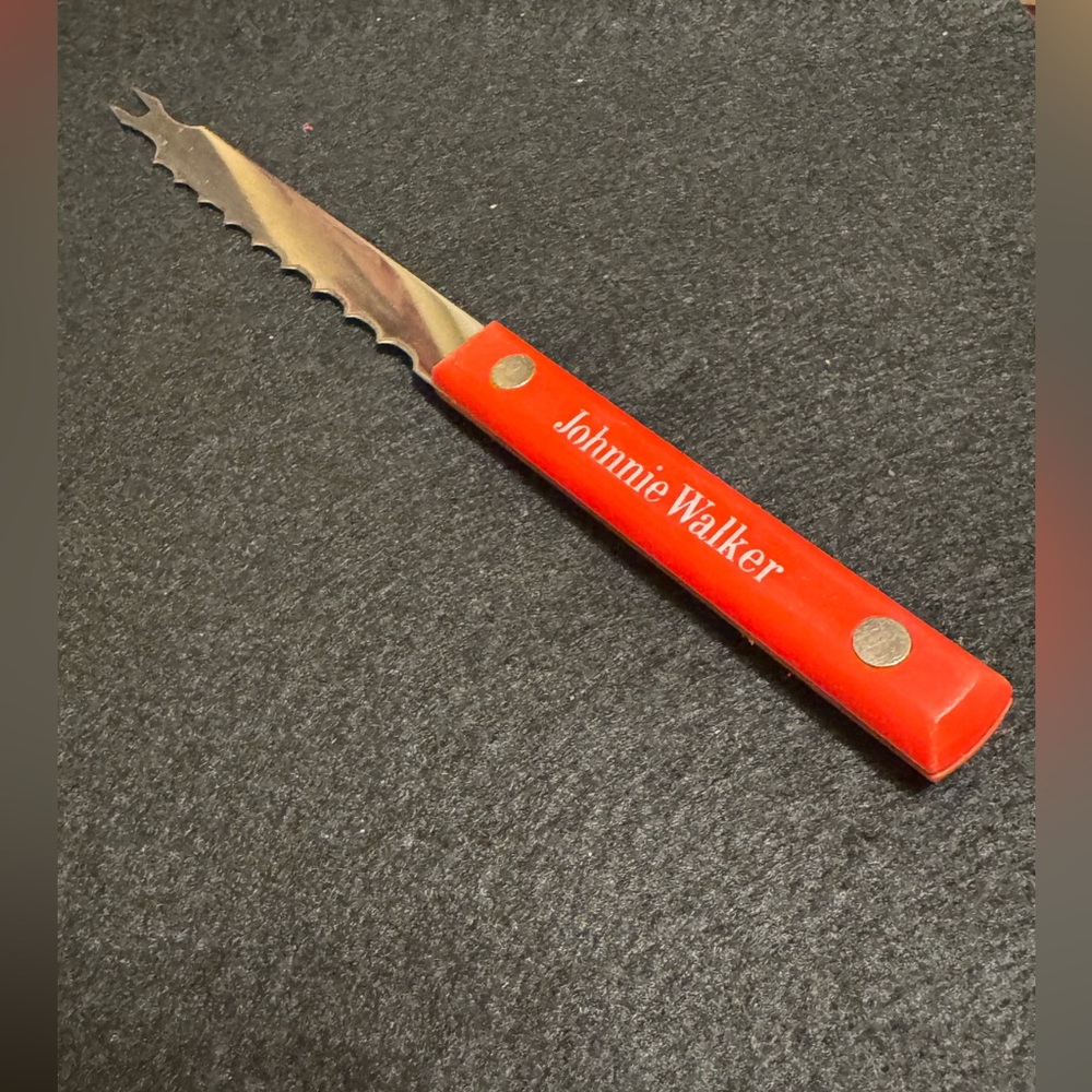 Vintage red handled Johnnie Walker scotch whiskey bar knife